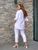 Жіночий брючний костюм білий кольору р.58/60 432749 432749 фото