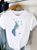 Жіноча футболка з принтом колір білий р.48/50 452045 452045 фото
