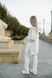 Жіночий спортивний костюм на флісі білого кольору р.42/44 444220 444220 фото 7