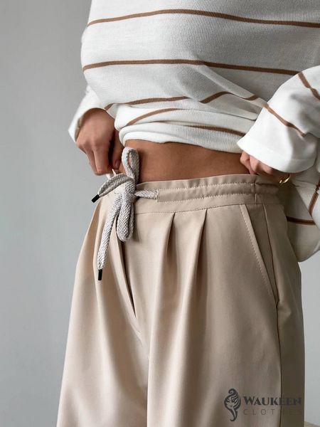Жіночі брюки з декоративним шнурком колір бежевий р.42 451519 451519 фото
