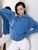 Жіночий светр із двома кишенями блакитного кольору 396898 396898 фото