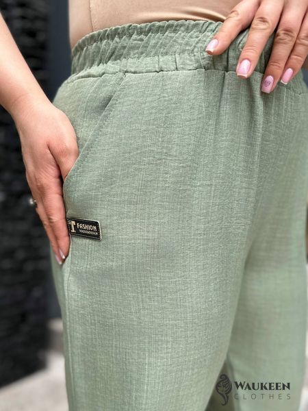 Жіночі брюки мом колір оливка р.50/52 454482 454482 фото